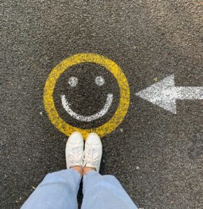 Happy face icon on pavement